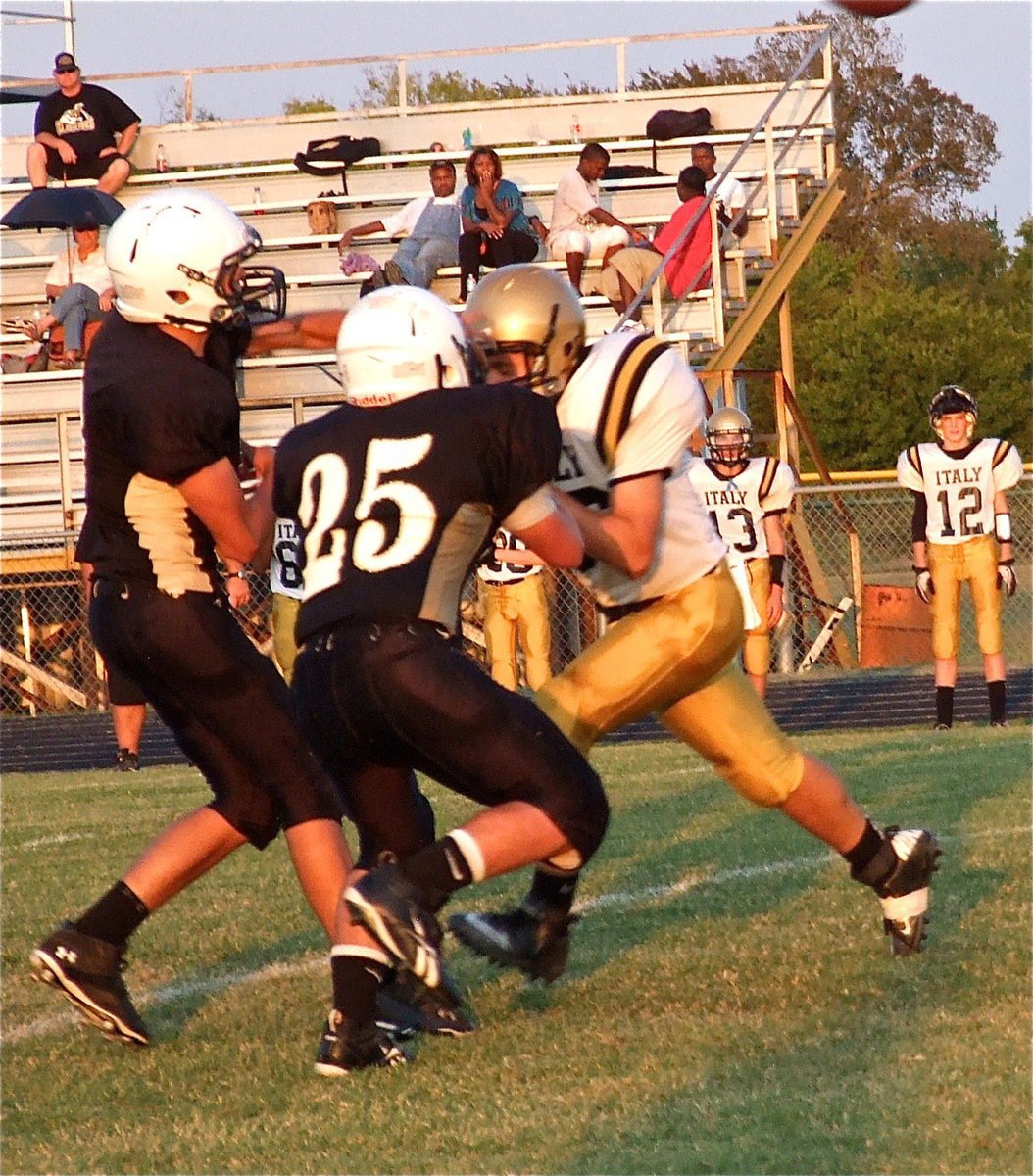 Image: Shot out of a cannon, Hunter Merimon(86) rips thru Hubbard’s pass protector to deliver the bomb on Hubbard’s quarterback.