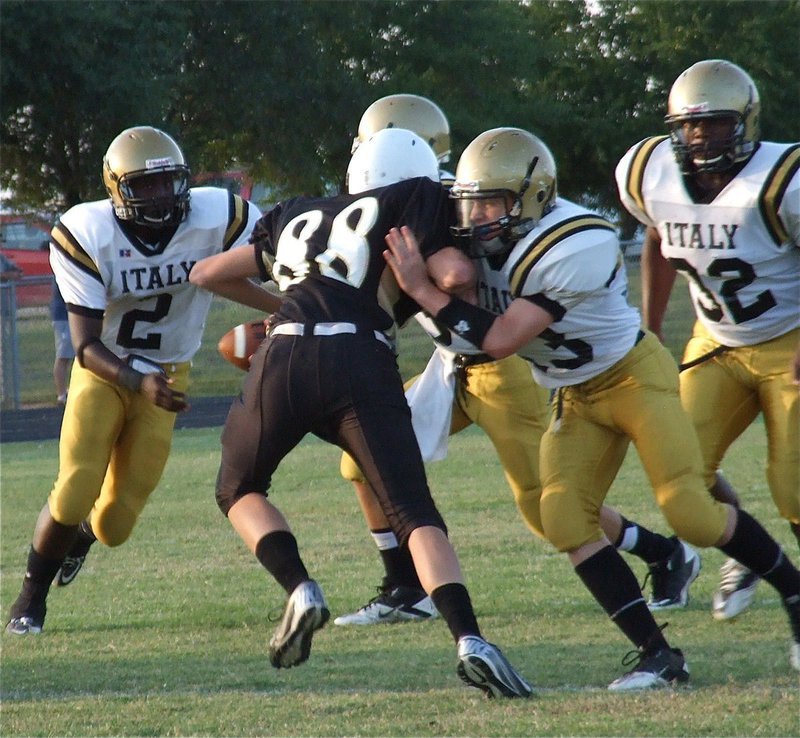 Image: John Escamilla(63) kicks out a Hubbard defender to create a lane for Marvin Cox(2).