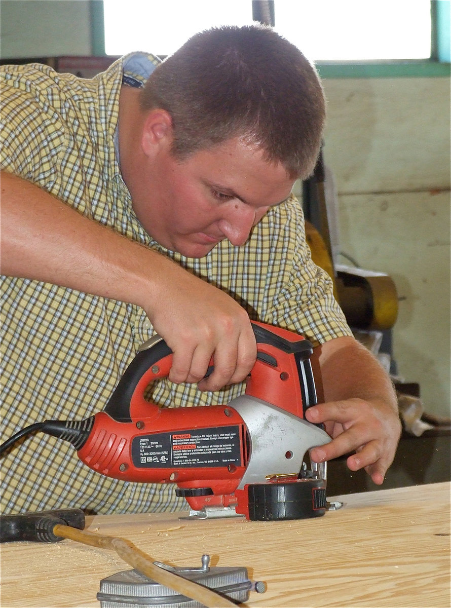 Image: Mr. Godwin demonstrates the ease of cutting a wavy line.