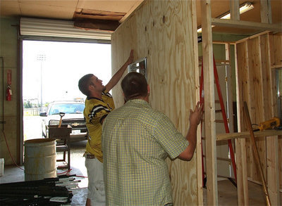 Image: Zack and Mr. Godwin add the second half of the exterior wall.