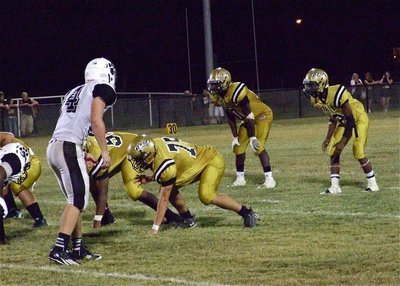 Image: Lineman Cody Medrano(75) and Darol Mayberry(58) are entrusted with protecting and clearing the way for Ryheem Walker(10) and Eric Carson(12).