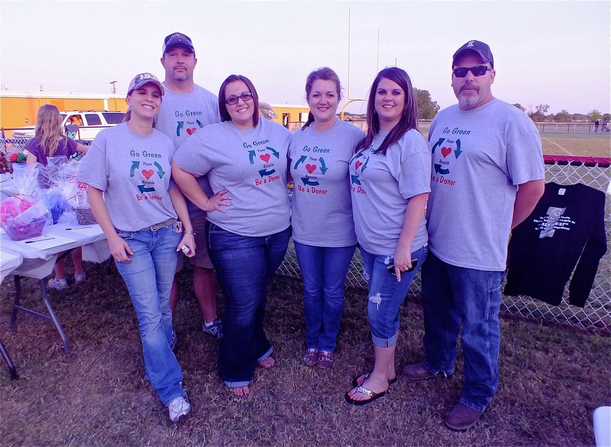 Image: “Team Hooker” volunteers Melissa Souder, Mark Souder, Haley Pittmon, Clover Stiles, Tina Long and Shane Long get the tables setup for Andrea’s auction.