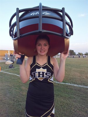 Image: Lady Gladiator cheerleader Taylor Turner has helmet hair.