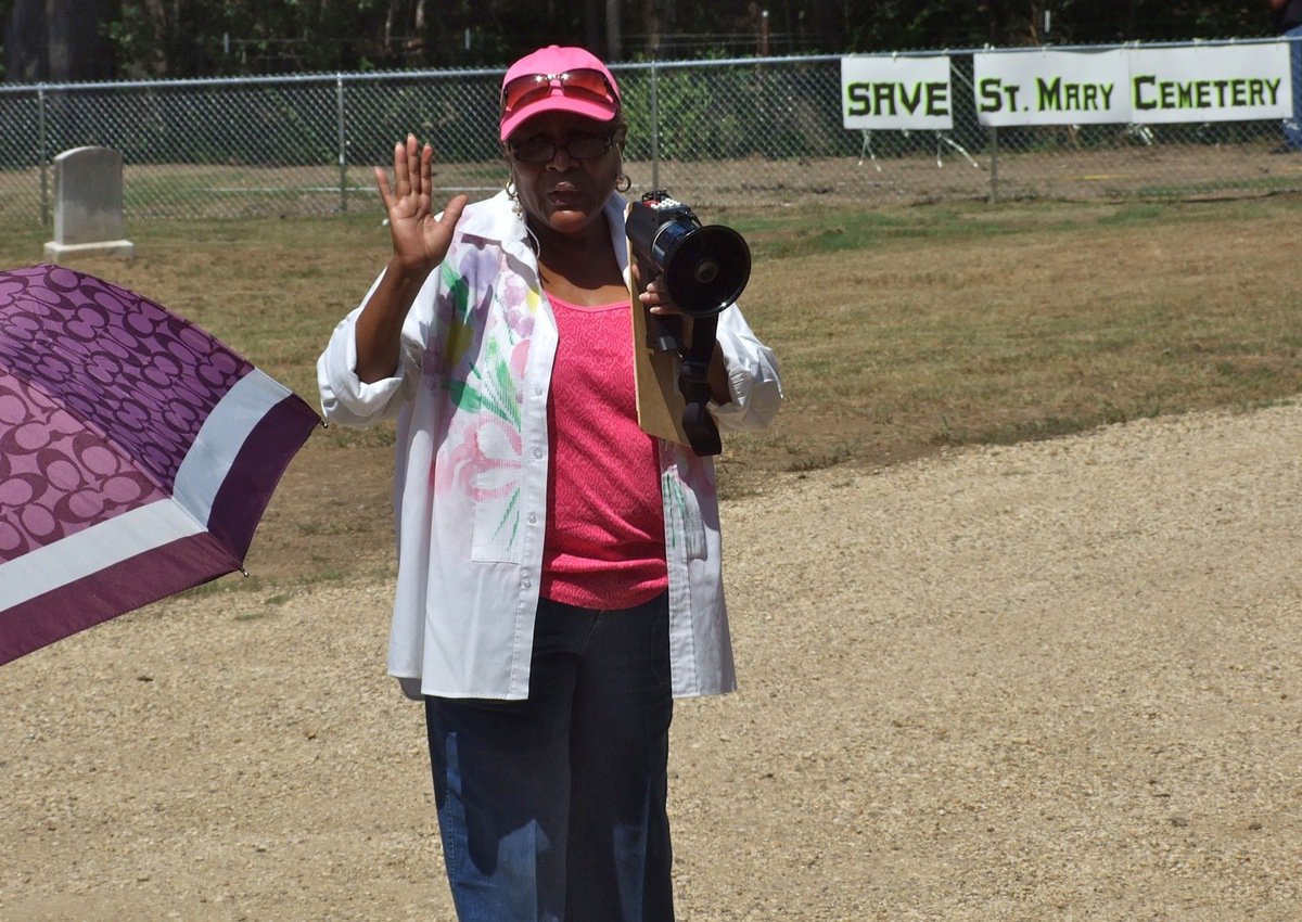 Image: On a mission to SAVE St. Mary Cemetery is local activist Elmerine Bell of Italy, Texas. Bell who speaks to fellow activist and supporters that drove in from around Ellis County and across the state to witness first hand the damage created by the Creek Land &amp; Cattle Company at the historic location.