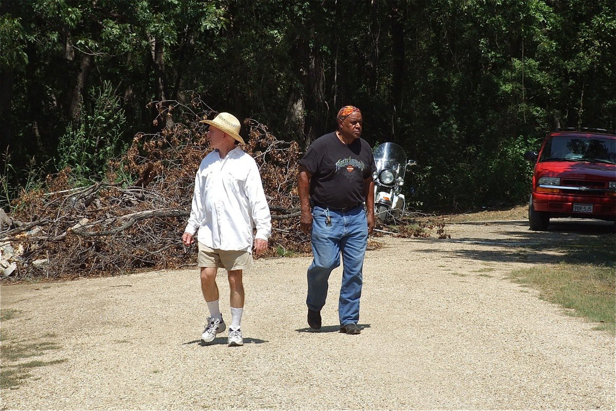 Image: All walks of life, young and old, attended the SAVE St. mary Cemetery Rally held recently near Italy, Texas to see for themselves the level of damage inflicted on the burial site by the Creek Land &amp; Cattle Company out of Nevada. On the left is Bruce Fowler who is a member of Ellis County Historical Commission. William Allen, on the right, along with Curtis Kirby, discovered the damage in March when they both arrived at the cemetery to mow the grass. Allen drove in on his motorcycle from Natchitoches, Louisiana and is the brother of Elmerine Bell.