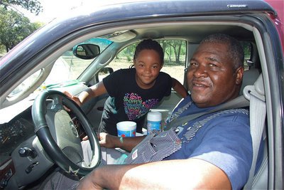Image: Naomi McKinney and her grandfather Willie Pyburn made the drive over from Blooming Grove to attend the SAVE St. Mary Cemetery Rally.