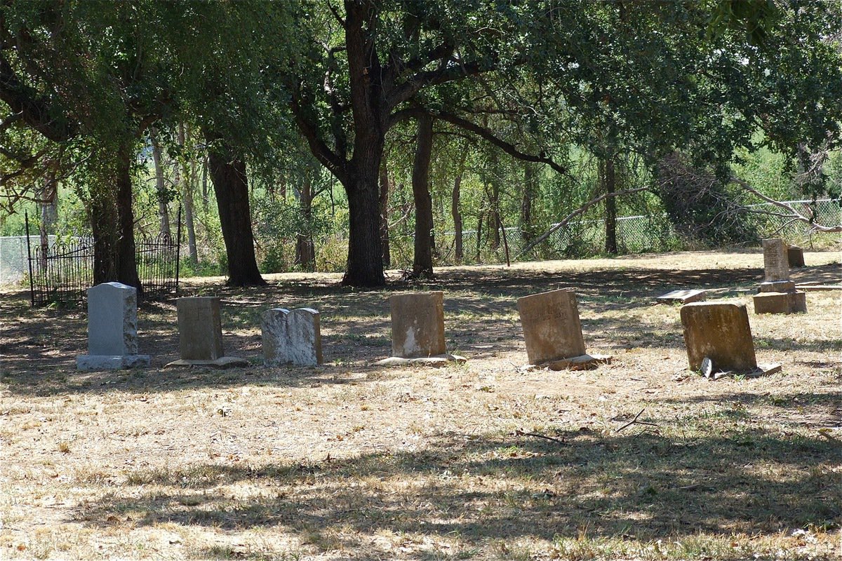 Image: After: Supporters were able to view the carnage at St. Mary. Visible grave indentations still exist beyond the newly installed fence line.