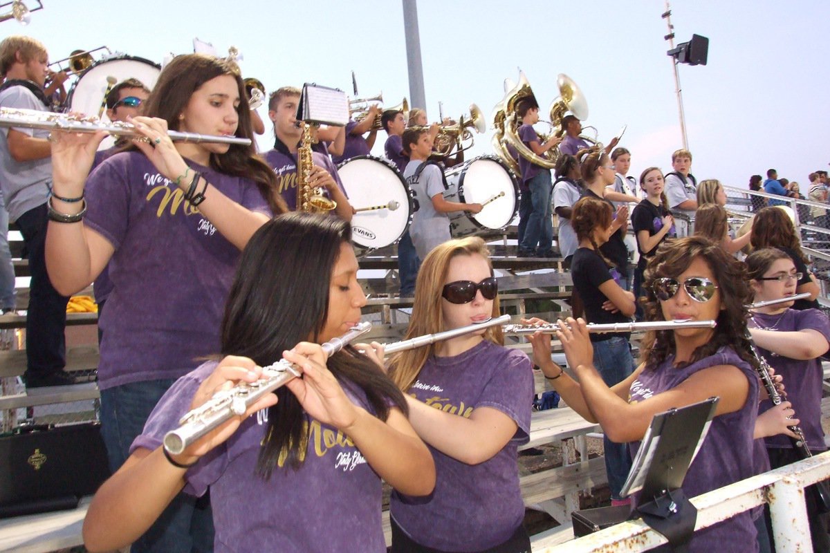 Image: The Gladiator Regimenet Marching Band plays the school song .