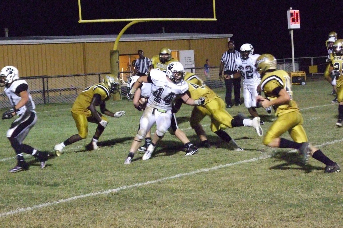 Image: Ryheem Walker(10), Trevon Robertson(4) and Zain Byers(50) stop Hubbard at the 1-yard line.