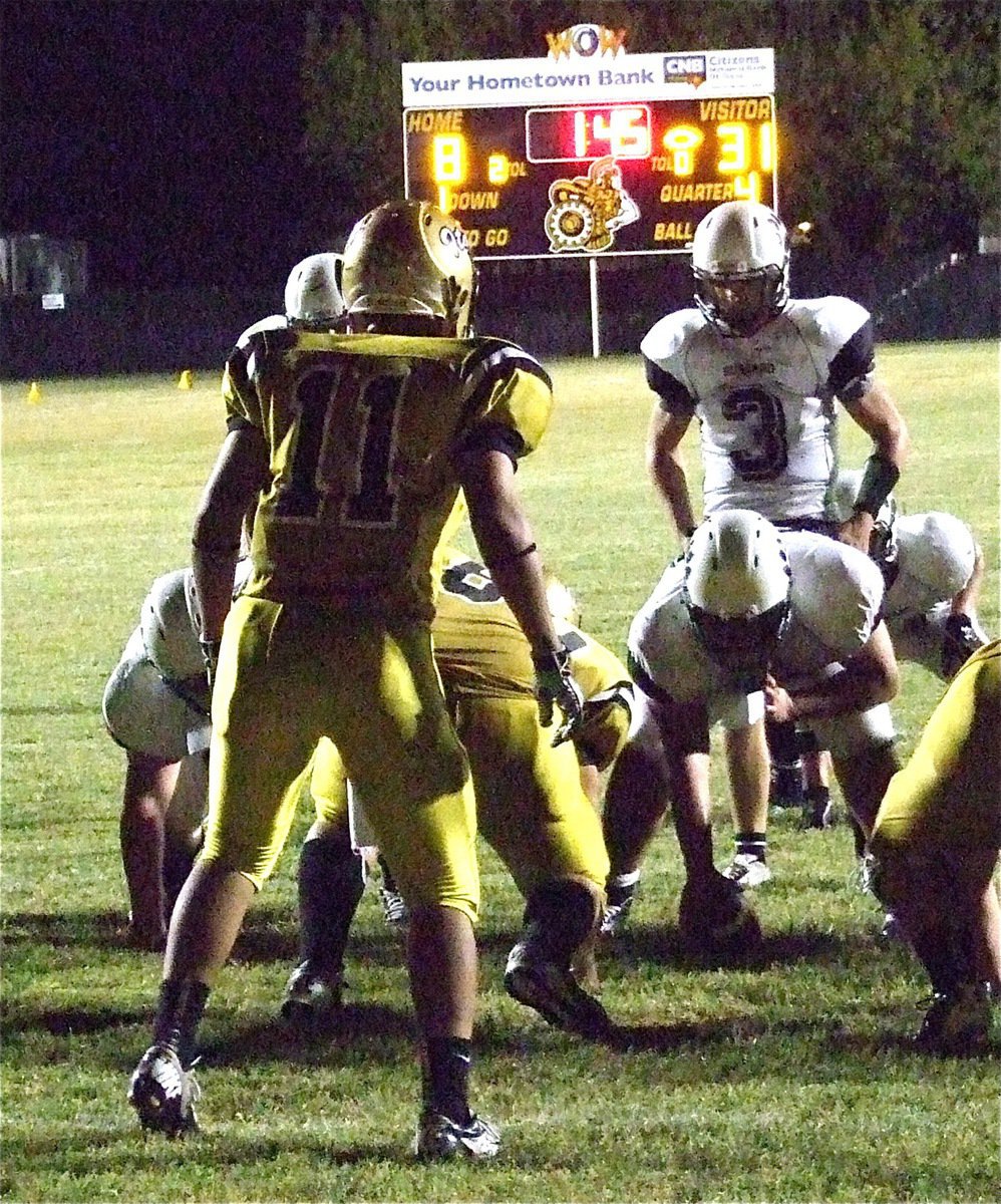 Image: Gladiator linebacker Reid Jacinto(11) eyes the Jaguar quarterback.