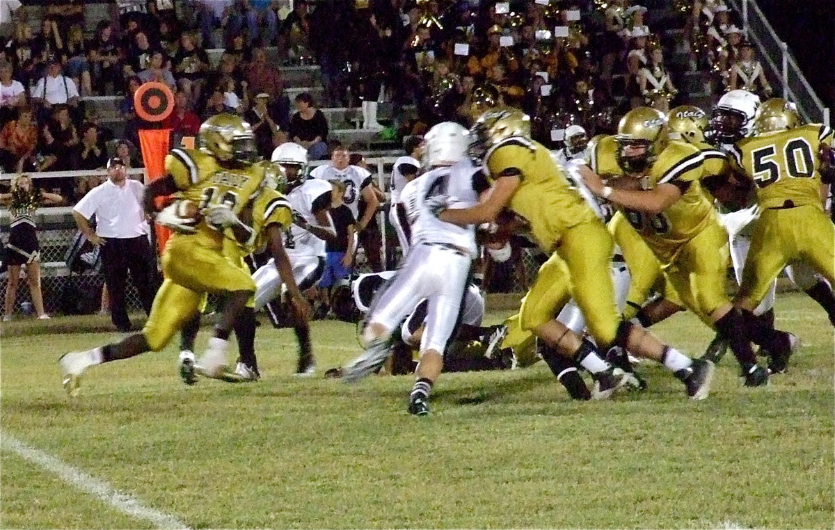 Image: Ryeem Walker(10) uses his offensive line to gain yards. The Gladiators have moved the ball this season but have struggled at times finding the end zone.