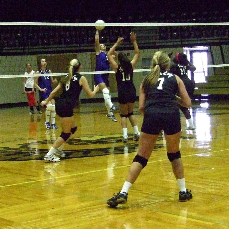 Image: Kelsey Nelson(8), Lillie Perry(10), Taleyia Wilson (11) and Hannah Washington(7) react to a spike attempt by Frost.