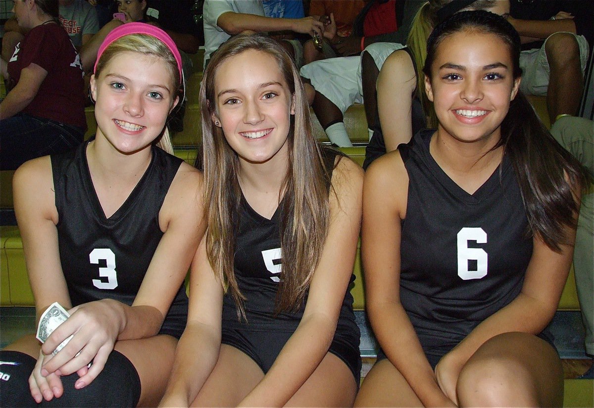 Image: JV Lady Gladiators Halee Turner(3), Jozie Perkins(5) and Ashlyn Jacinto(6) are all smiles during Tuesday’s volleyball games inside Italy Coliseum.