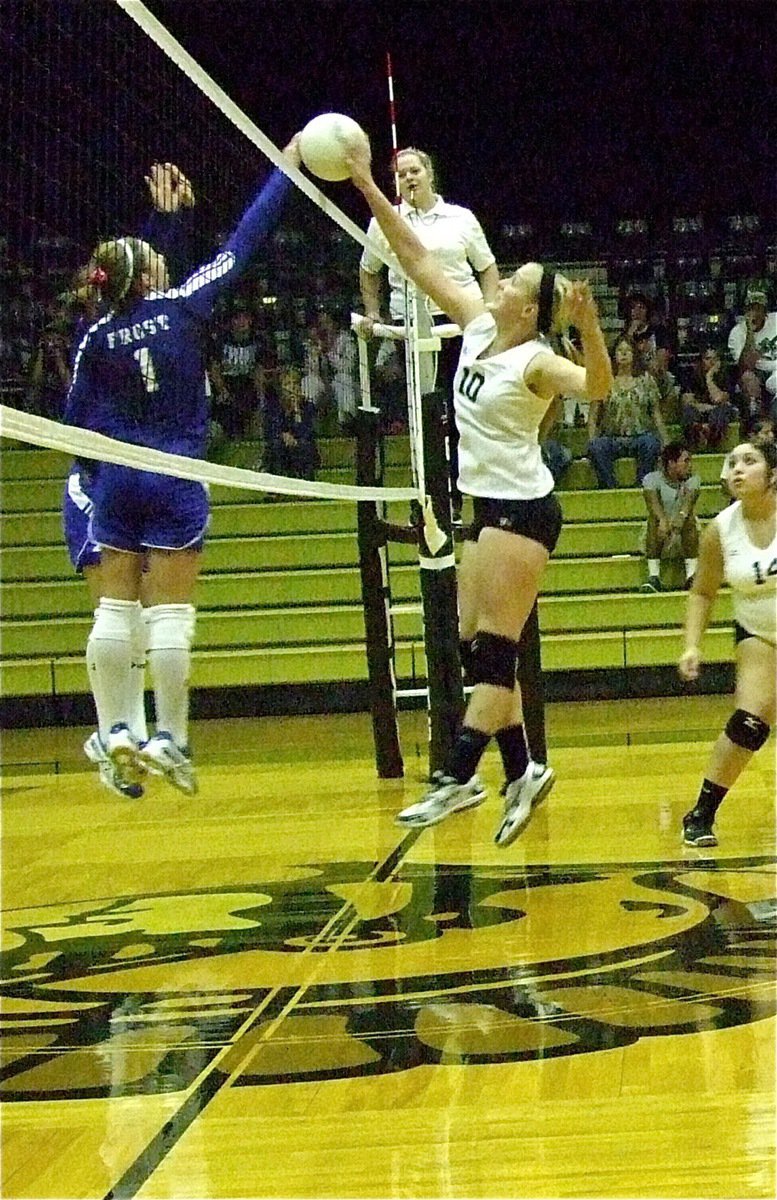 Image: Madison Washington(10) wins a jousting match forcing a Frost player to illegally touch the net.