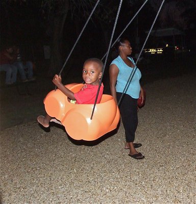 Image: Kids jumped in the car swings to work on the high speed pursuits during National Night Out.