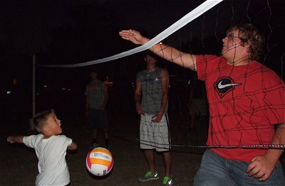 Image: All ages enjoyed National Night Out as Colin Newman (Red shirt) displays his superior volleyball skills.