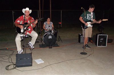 Image: The Fox Country Band performs for guests attending the National Night Out celebration at the George E. Scott Memorial Park in Italy, Texas.