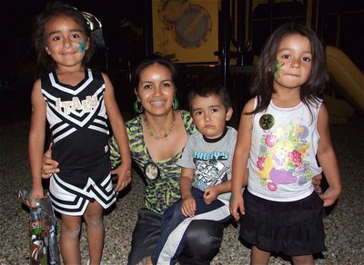 Image: Itzy of Itzy’s Fashions in Italy attends National Night Out with her children.