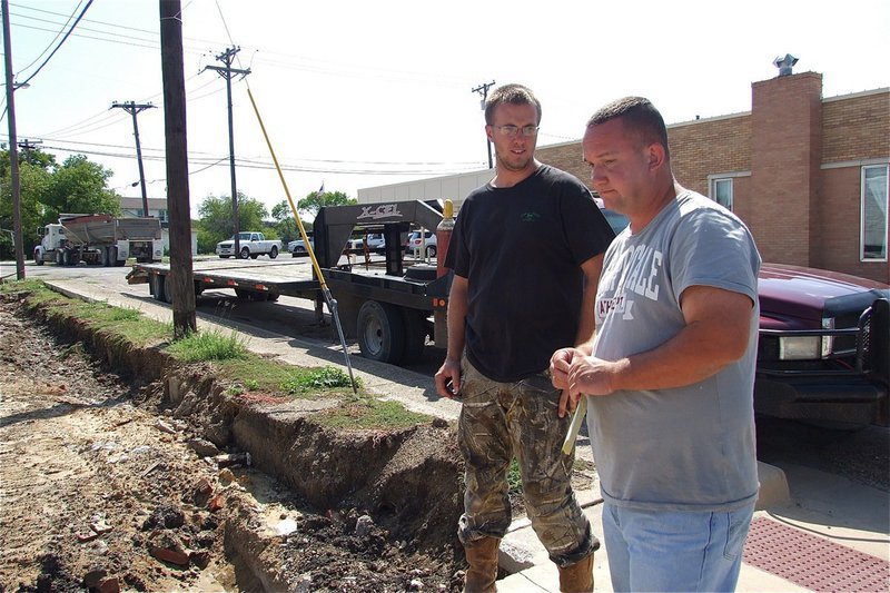 Image: Michael Bowles (on the right), owner of Bowles Redi Mix, Inc. of Italy, will handle the pouring of the concrete foundation for the new pavilion.