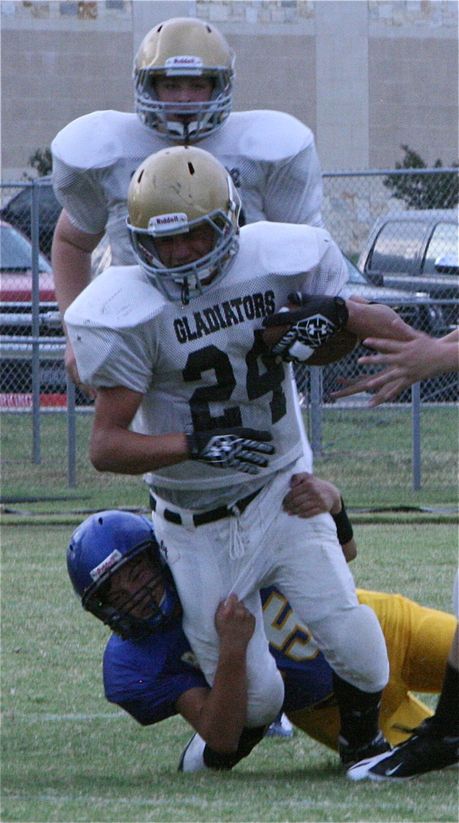 Image: Joe Celis(24), healed after twisting his ankle during this play against Sunnyvale, helps lead the 8th grade Gladiators to an 18-6 win over Kerens this past Thursday.