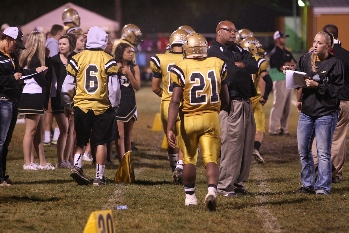 Image: A home field sideline scene.