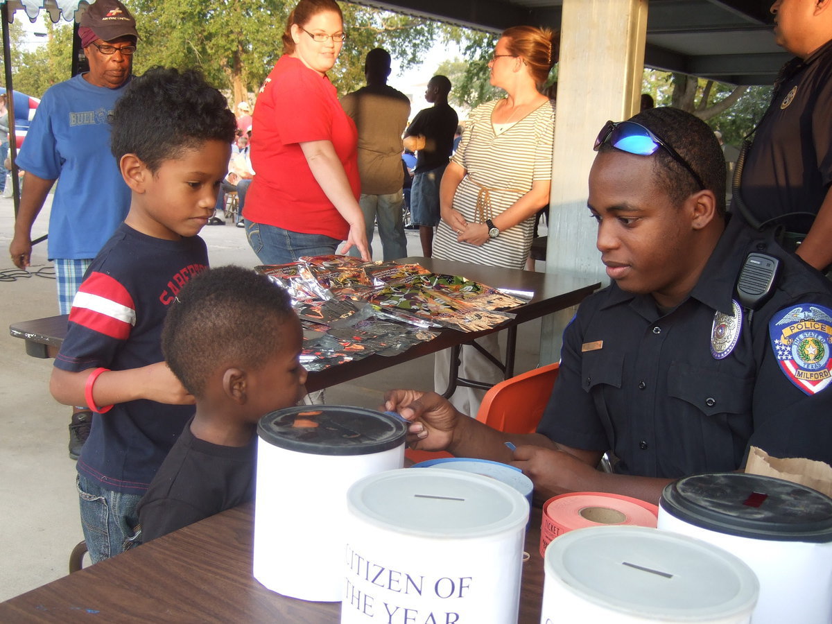 Image: Milford Police officer talking about safety tips with the children.