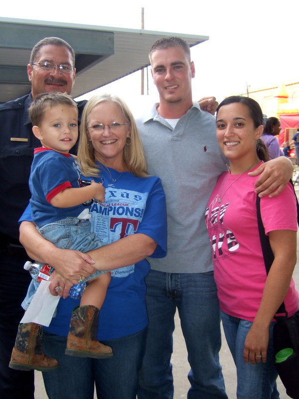 Image: Chief Carlos Phoenix, Brad Montgomery, Porter Montgomery, Lisa Phoenix and Kasey Montgomery enjoying family time at National Night Out.