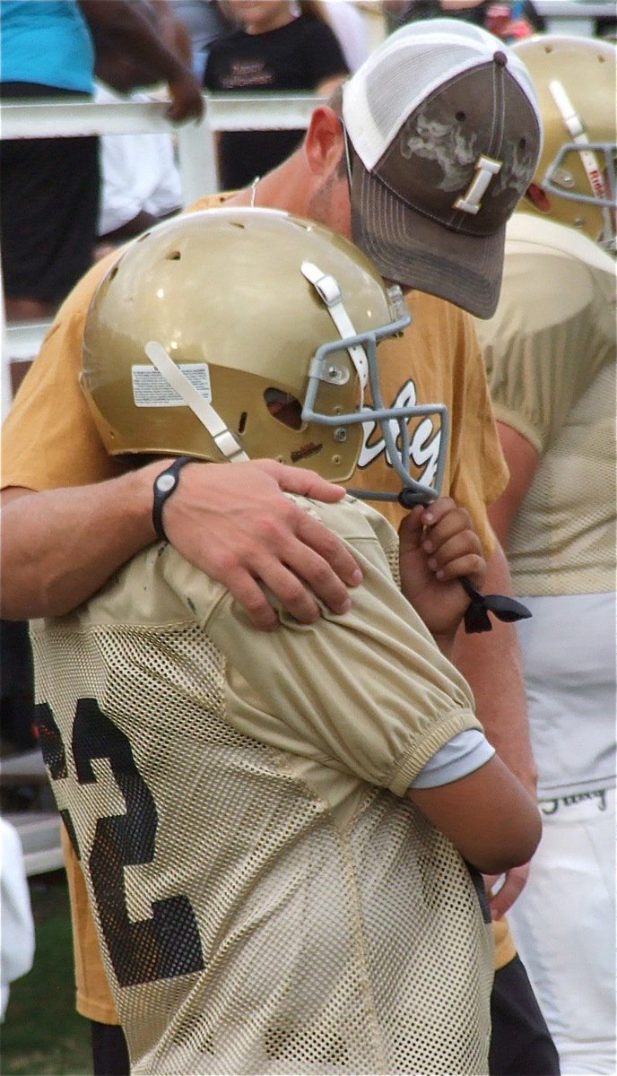 Image: Coach Nate Skelton talks shop with Gabriel Guzman(62).