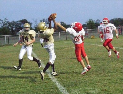 Image: 8th grade Gladiator Michael Wilson(85) makes a catch at the goal line for an Italy touchdown.