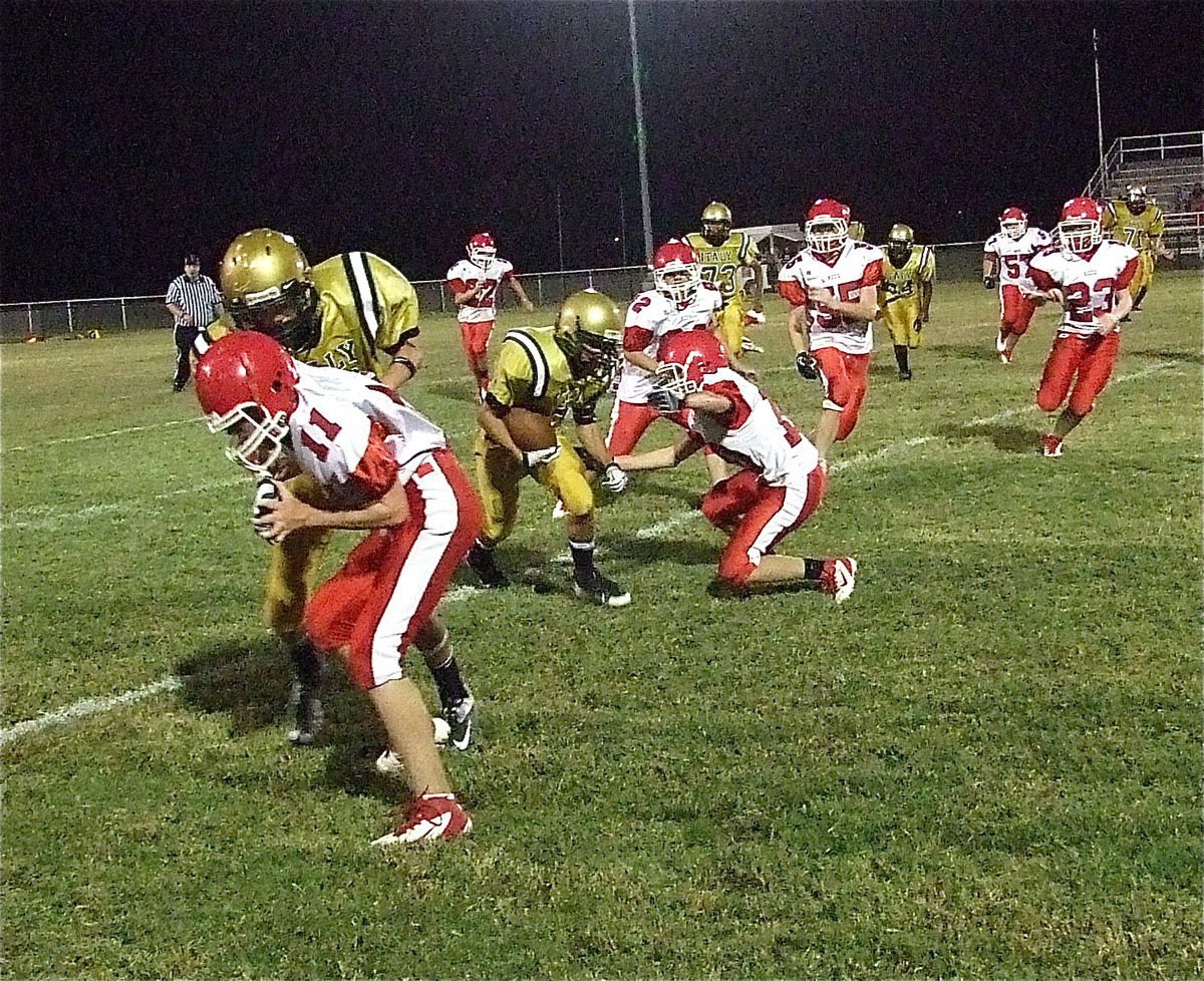 Image: Italy’s Ty Windham(12) blocks out the Hico cornerback to make room for fellow receiver Levi McBride(9) to run after the catch.