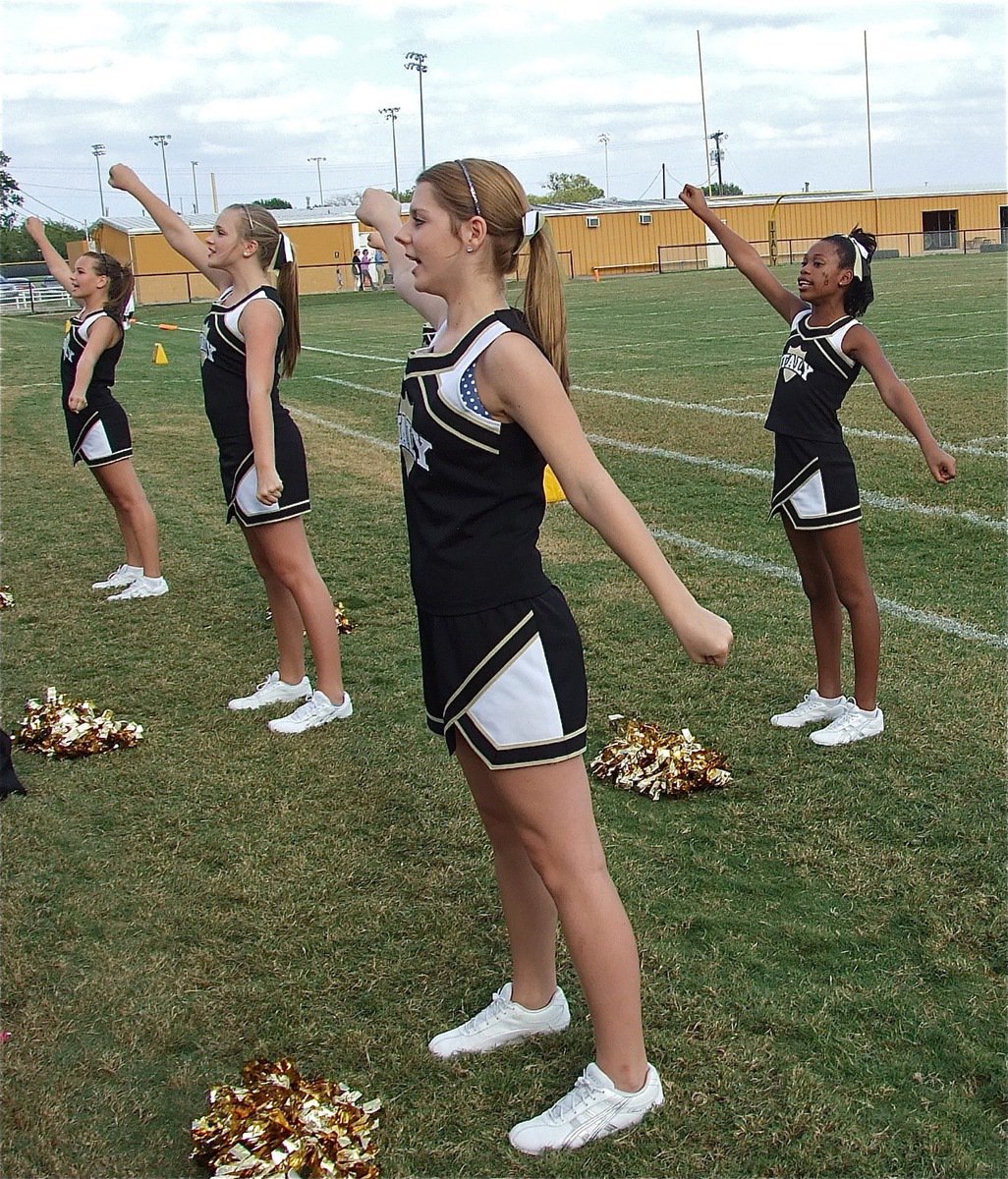 Image: Italy Junior High cheerleaders Paige Little, Annie Perry, Brooke DeBorde and Sierra Wilson are synchronized spirit makers.