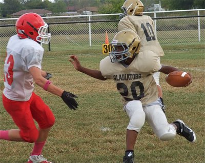 Image: Kendrick Norwood(20) avoids a Hico defender and then gains positive yards.