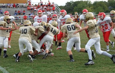 Image: The 7th grade defense converges on the Tiger tailback.