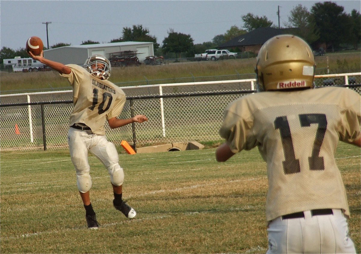 Image: Ty Hamilton(17) gets open as Tylan Wallace(10) passes the ball downfield to his receivers.