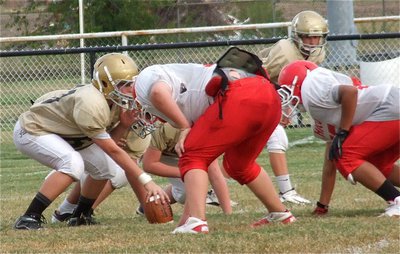 Image: Clay Riddle(60) snaps for the 7th grade Gladiator defense.