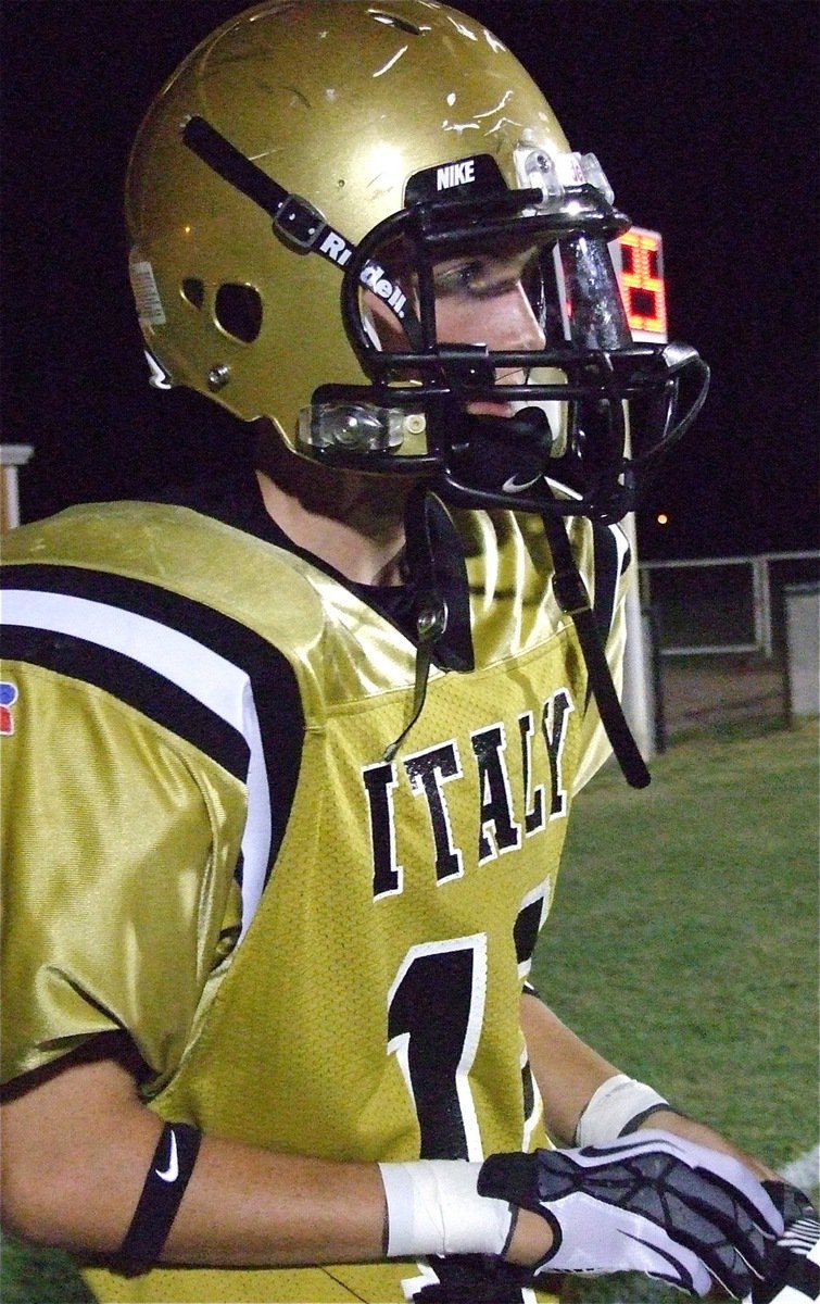 Image: Ty Windham(12) gets gloved up, buckled up and fired up to take on Hico.