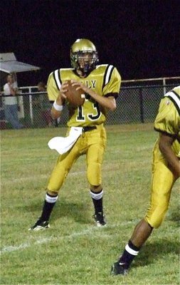 Image: JV quarterback Ryan Connor(13) drops back in the pocket.