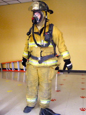 Image: Italy Volunteer fireman Russell Coers dressed in full bunker gear.