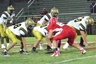 Image: Zackery Boykin(88), Zain Byers(50) and Kevin Roldan(60) lay it on the line with Chase Hamilton(2) and Marvin Cox(3) in the backfield.