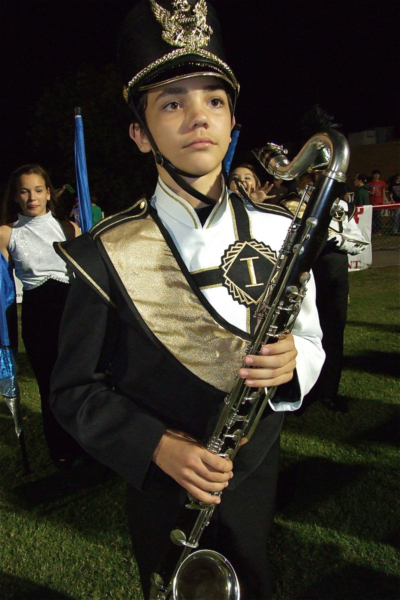 Image: When 8th grader Blake Brewer is not getting sacks on the grid-iron he plays his sax for the Gladiator Regiment Marching Band.