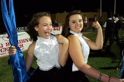 Image: The Color Guard girls are, well, colorful. Paige Little and Alexis Burchett help pump up the Gladiator spirit.