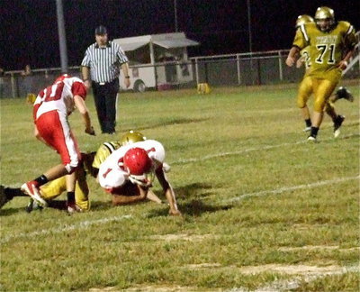 Image: JV Gladiator Clayton Miller(88) fights off a block and then makes a leg tackle in open field that held Hico to a minimum gain.