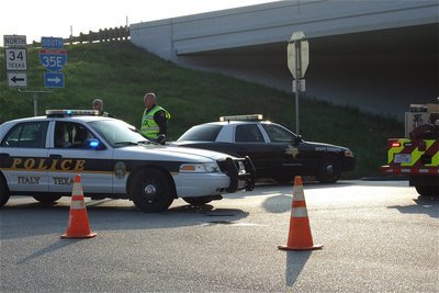 Image: Italy Police Chief Diron Hill and Officer Shawn Martin redirect traffic around the bridge.