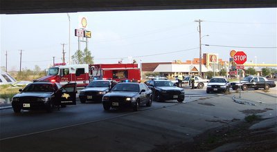 Image: State troopers, the Italy Police and Fire Departments and the Forreston Fire Department converge under the bridge.
