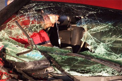 Image: IFDs Paul Cockerham examines the interior of the suspect’s vehicle.