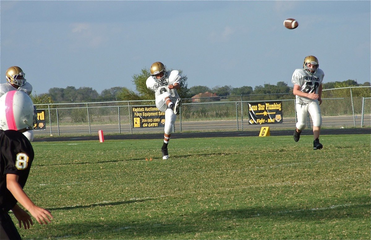 Image: Tylan Wallace(9) kicks off to the Wampus Cats as Hunter Morgan(58) heads upfield.