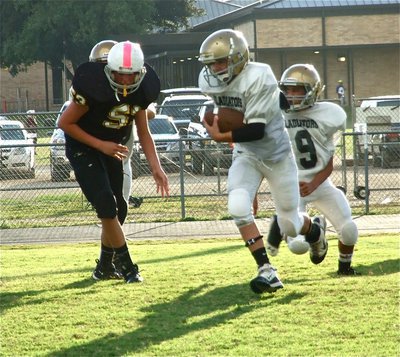 Image: Gary Escamilla(7) takes the handoff from Tylan Wallace(9) and charges into the end zone for his first touchdown of the 2012 season.