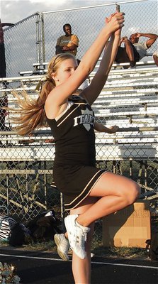 Image: Cheerleader Annie Perry promotes team spirit on the sideline.