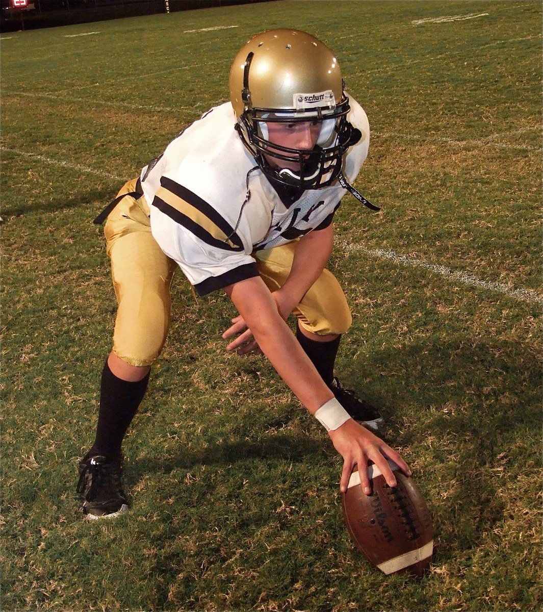 Image: Brandon Connor practices snapping in his first start at center for the Italy’s JV squad.