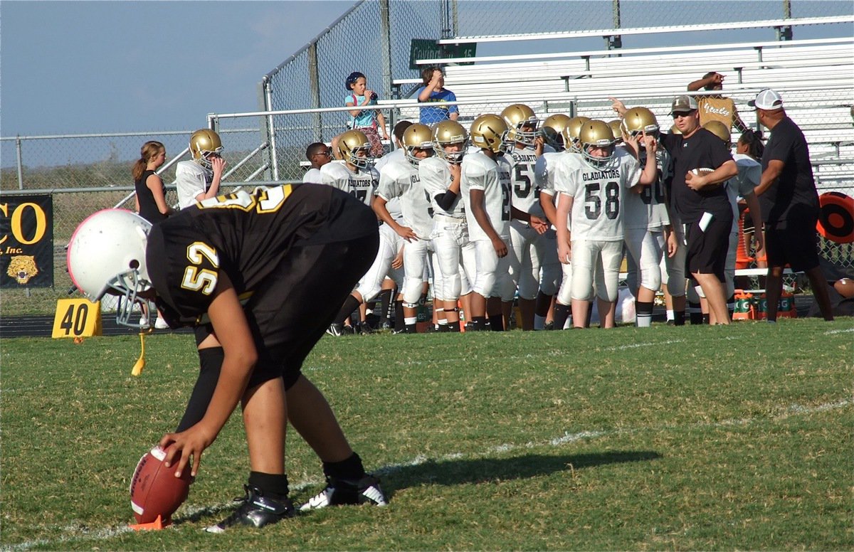 Image: Coaches Josh Ward and Larry Mayberry prepare to send Italy’s 7th grade Gladiators out for the opening kickoff against Itasca.